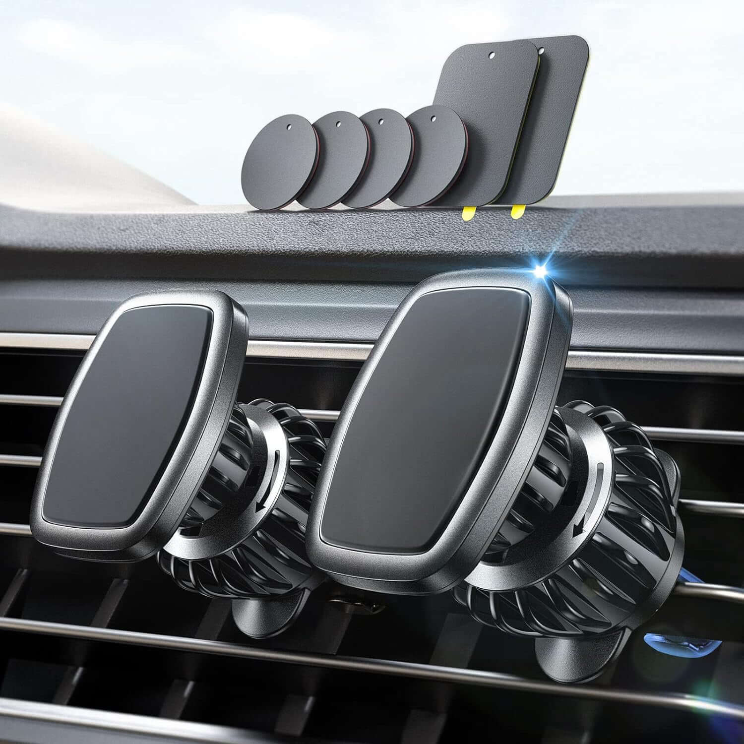 Magnetic phone car vent mount with dual holders and multiple magnetic plates for secure smartphone support.